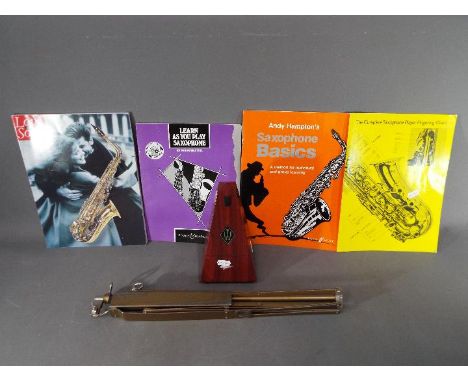 A lot to include a West German Wittner metronome, music stand and music books.