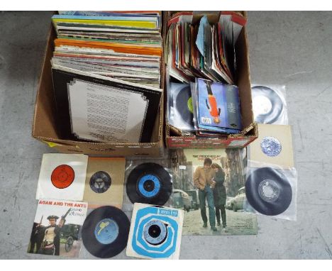 Two boxes containing a quantity of 33 and 45 RPM vinyl records to include Bob Dylan, The Troggs, A-HA, Queen, Soft Cell, The 