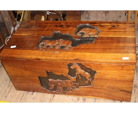 A vintage Camphor wood trunk with animal detail. Collection only 