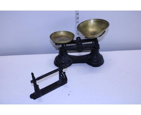 A set of vintage kitchen scales and a antique toilet roll holder 