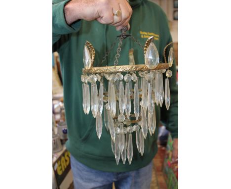 A vintage ceiling light with glass droplets 