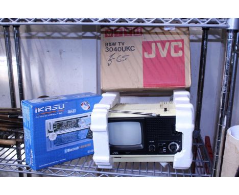 A vintage JVC black and white portable TV and a car stereo 
