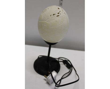 A vintage table lamp made from a carved Ostrich egg 