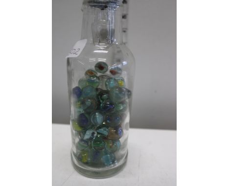 A vintage bottle with marbles 