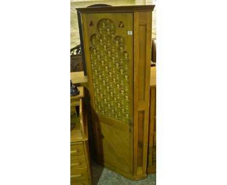 A 19th century ash double corner cloak cabinet with tapestry front 