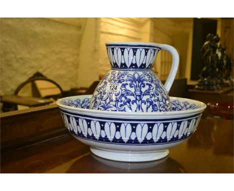 A blue and white pottery ewer and basin 