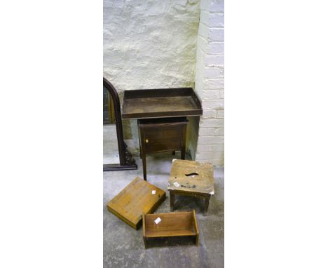 A mahogany bedside pot table, oak stained book trough, a mahogany supper tray, a ash stool and a glass carrying box