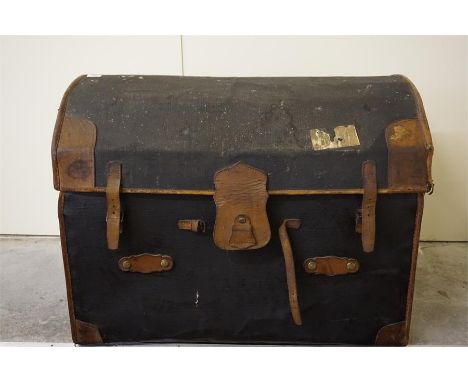 Late 19th century canvas and leather dome topped travelling trunk.  28" high and 36" wide