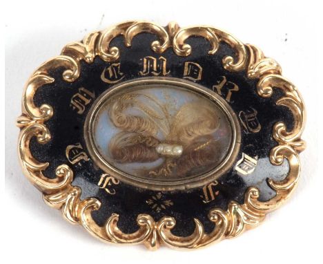 A 19th century memorial brooch, the black enamel brooch with 'In Memory' to front, with central glazed panel with hairwork an