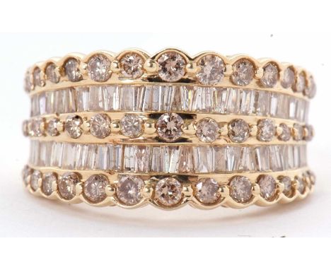 A 14ct diamond ring, the wide tapering band set with a row of small round brilliant cut diamonds, with a row of tapered bague