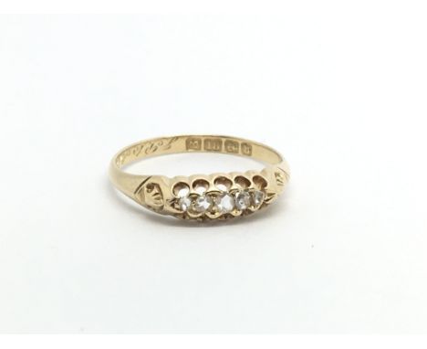 An 18carat gold ring set with a row of five diamonds ring size K-L