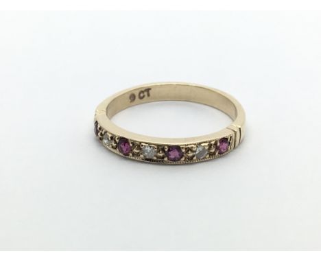 A 9ct gold ruby and diamond half eternity ring, approx 1.7g and approx size K.