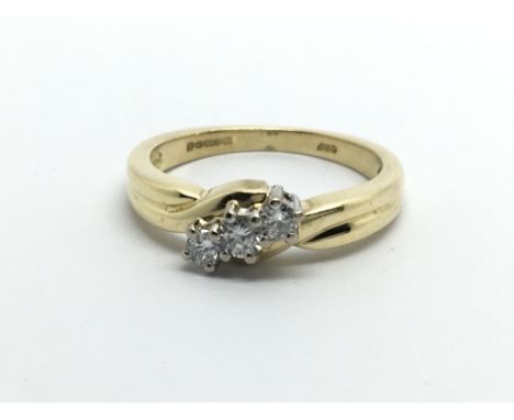 An 18ct gold three stone diamond ring, approx.10ct, approx 3.7g and approx size J.