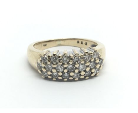 A 9ct gold ring set with three rows of diamonds, approx .55ct, approx 3.9g and approx size I- J.