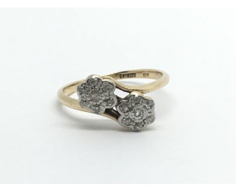 A Vintage 18carat gold ring set with two clusters of diamonds ring size K-L
