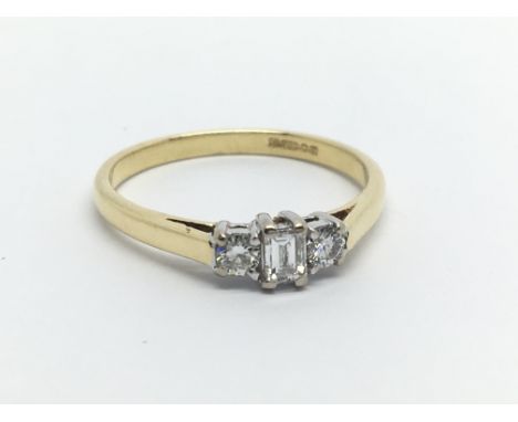 An 18ct gold ring set with three diamonds, approx 2.7g and approx size N-O.