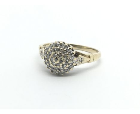 A 9ct gold diamond cluster ring, approx 2g and approx size L.