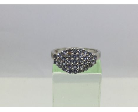 A 9ct white gold ring set with tanzanite, approx 4.3g and approx size P.