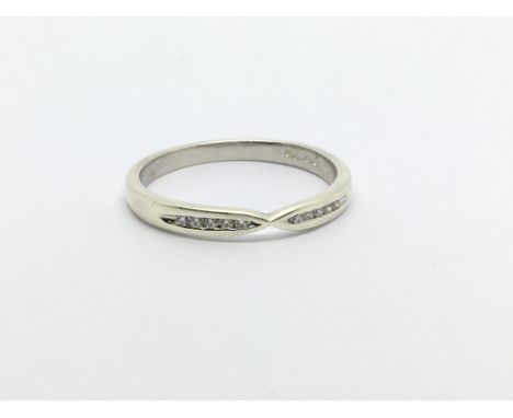 A 9ct white gold ring set with ten small diamonds, approx 2g and approx size N-O.