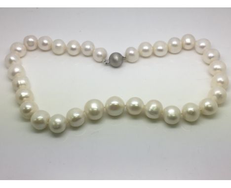 A cultured pearl necklace with a 9ct white gold ball clasp.