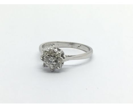 An 18carat white gold ring set with a pattern of diamonds. Ring size J-K