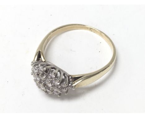 A 9ct gold and diamond cluster ring (T), 1 stone missing.