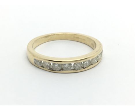 An 18ct gold half eternity ring set with nine diamonds, approx 1/2ct, approx 2.8g and approx size L-M.