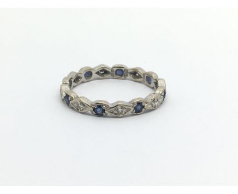 An 18ct white gold ring set with diamonds and sapphires, approx 2.5g and approx size M.