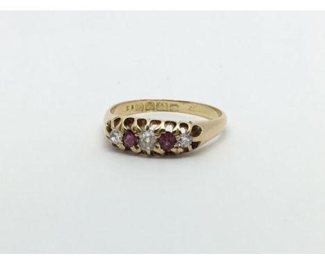 An 18ct gold vintage ruby and three diamond ring, approx 3g and approx size L-M.