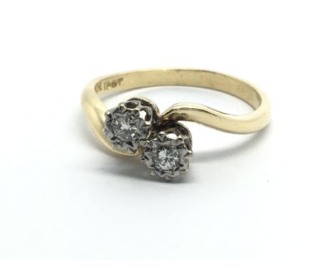 An 18ct gold ring set with two diamonds, approx .13ct, approx 3.5g and approx size N-O.