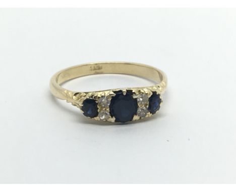 An 18carat gold ring set with three sapphire and small diamonds ring size P-Q