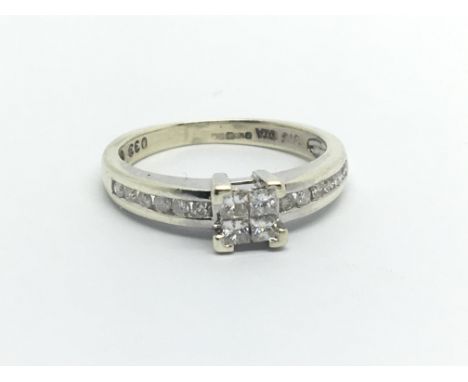 A 9ct white gold and .33ct illusion set diamond diamond ring. (I/J)