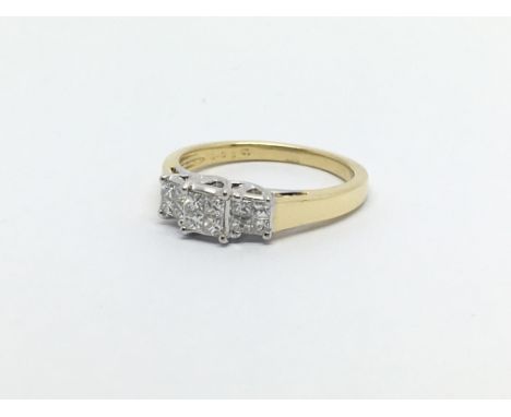 An 18ct gold diamond ring set with 12 princess cut diamonds, approx .33ct, approx 3.7g and approx size L-M.