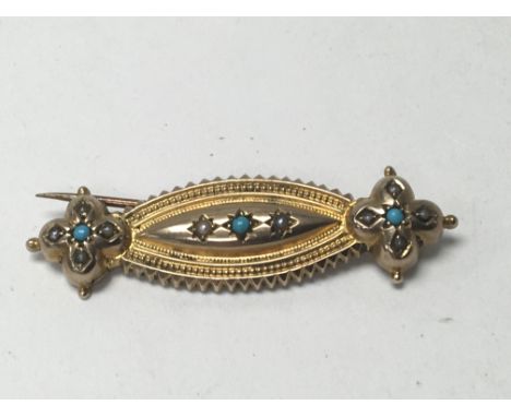 A Edwardian 9 ct brooch inset with turquoise and seed pearl stones .