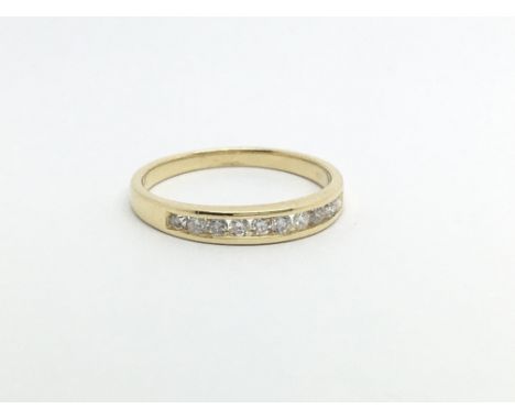 An 18ct gold half eternity ring set with ten small diamonds, approx 2.2g and approx size M.