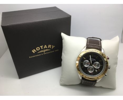 A cased gents Rotary chronograph watch with brown leather strap.
