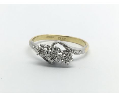 An 18carat gold and platinum ring set with three diamonds ring size M.