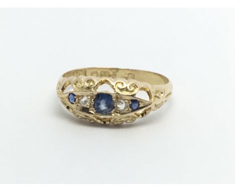 A Vintage gold ring set with blue sapphire and chip stone diamonds ring size O-P