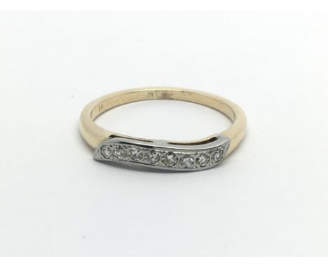 An 18ct gold ring set with eight small diamonds, approx 1.8g and approx size J-K.