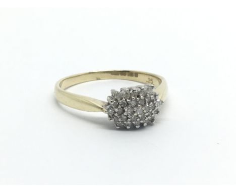 A 9carat yellow gold ring set with a pattern of diamonds approximately 0.20 of a carat ring size S.