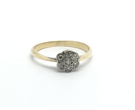 A Vintage 18carat gold ring set with a pattern of diamonds ring size M-N