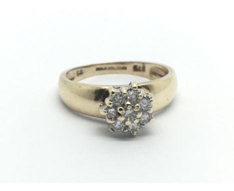 A 9ct gold eight stone diamond cluster ring, approx 2g and approx size I.