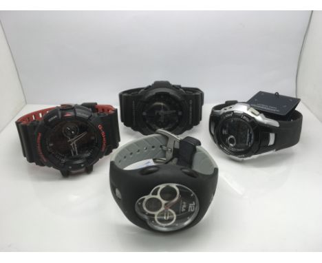 Four watches including two Casio G Shock examples.