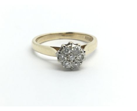 A 9ct gold seven stone diamond cluster ring, approx 2.3g and approx size J-K.