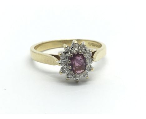 An 18ct yellow gold ruby and diamond set ring ( N/O), approx 3.5g.
