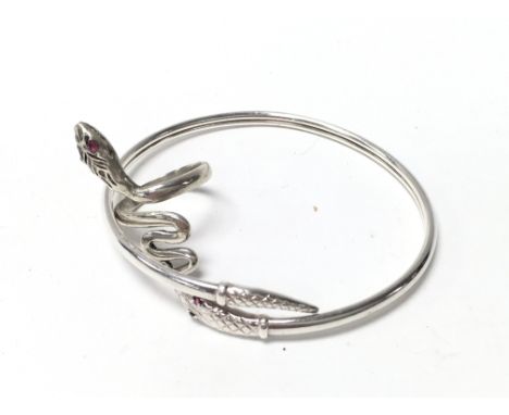 A sterling silver snake bangle with stone set eyes and a similar snake ring (Q).