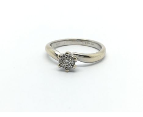 An 18ct white gold diamond ring in the form of a flowerhead, approx 2.5g and approx size J.