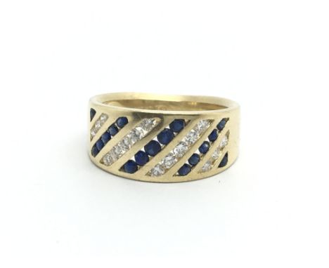 An 18ct gold sapphire and diamond set ring, (L/M) approx 7.2g