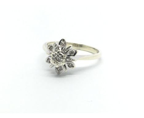 A 9ct gold seven stone diamond cluster ring, approx 2.7g and approx size M-N.