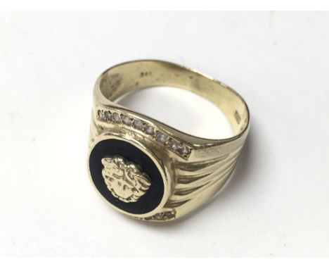 A 14ct gold and stone set Versace style ring.